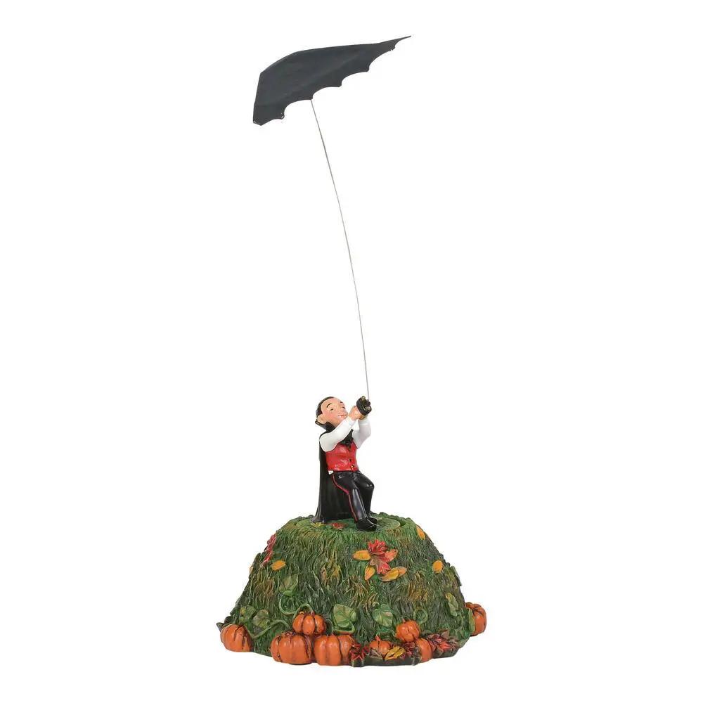 Bat Kite Fright Spooky Night Flying Toy bat kite atop pumpkin hill with a kneeling figure on Tampa Home & Garden Store