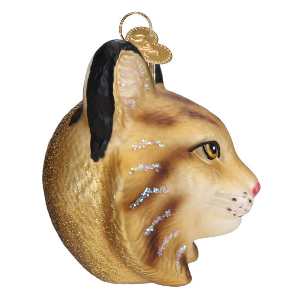 Bobcat head glass ornament hand-painted with gold glitter back and silver facial accents on Tampa Home & Garden Store