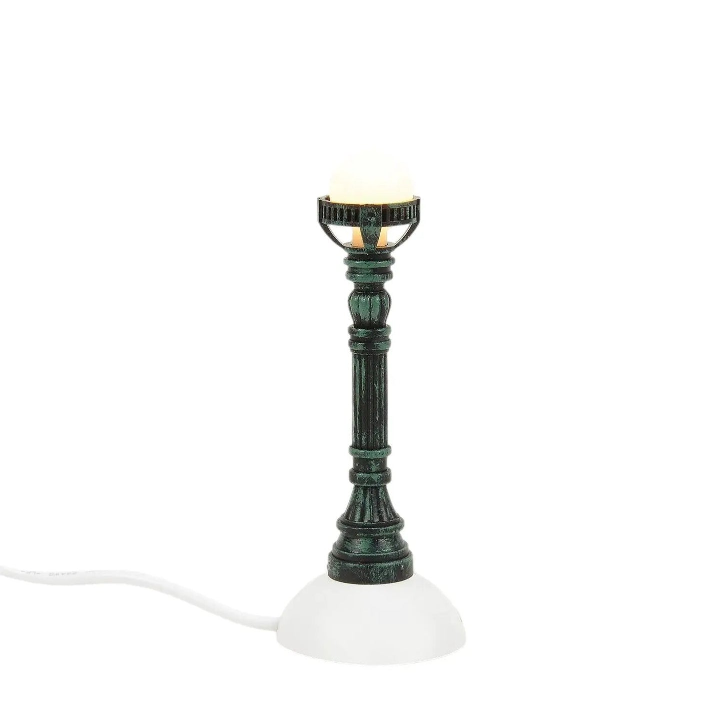 Copper lamp post for holiday village display with green patina finish and white base on Tampa Home & Garden Store
