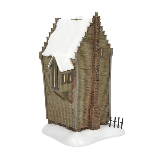 Shrieking Shack Replica Christmas village house from Hogwarts Ghosts, brown log cabin with snow on Tampa Home & Garden Store