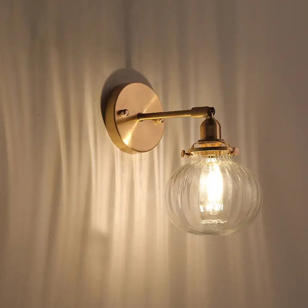 Vintage brass wall light sconce by Decorbites with champagne and clear glass globe shade on Tampa Home & Garden Store
