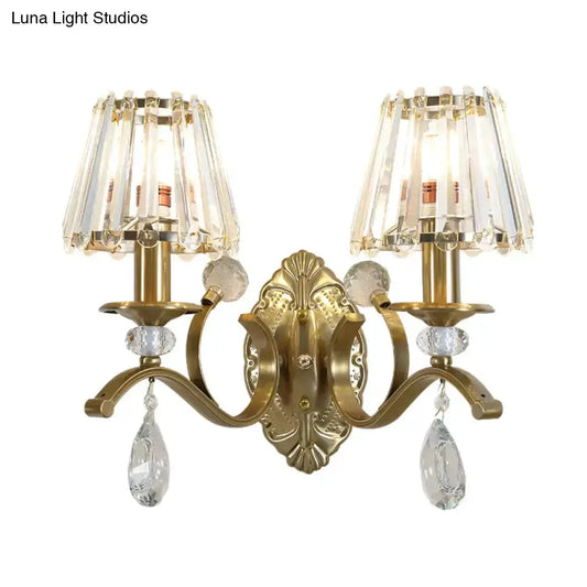 Vintage gold metal double-armed wall sconce with crystal teardrop prisms on Tampa Home & Garden Store