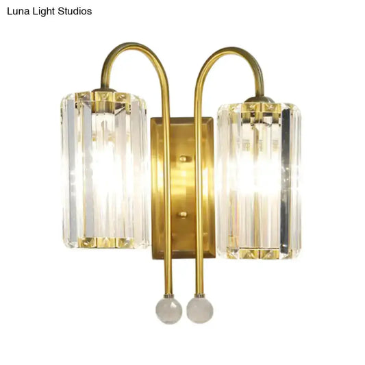 Vintage gold gooseneck dual-light wall sconce with crystal prism shades and gold backplate on Tampa Home & Garden Store