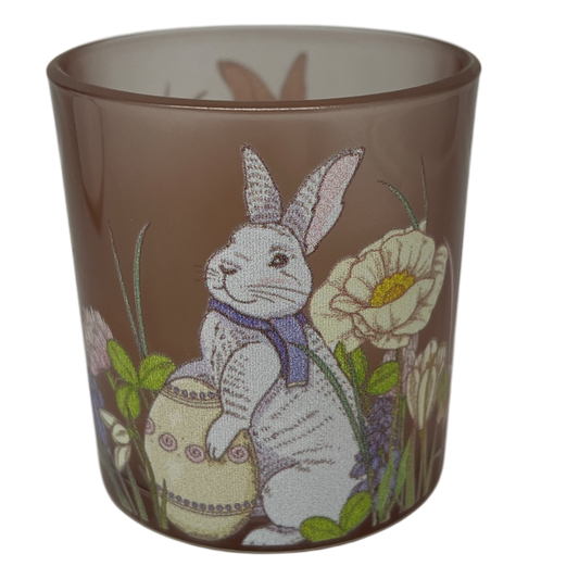 Easter themed candle holder featuring a white bunny among flowers on brown glass on Tampa Home & Garden Store
