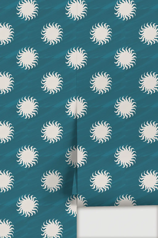 Sol Wallpaper blue and white sunburst motif on teal background with repeating pattern on Tampa Home & Garden Store