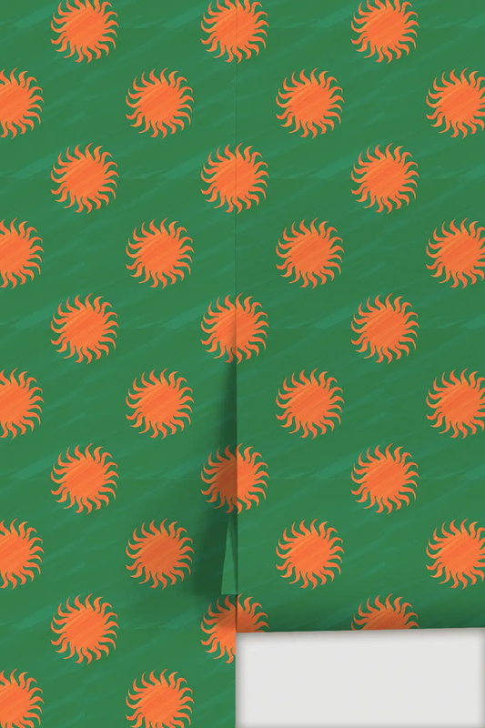 Sol wallpaper green with orange sunburst motifs in a repeating pattern; seam visible on Tampa Home & Garden Store