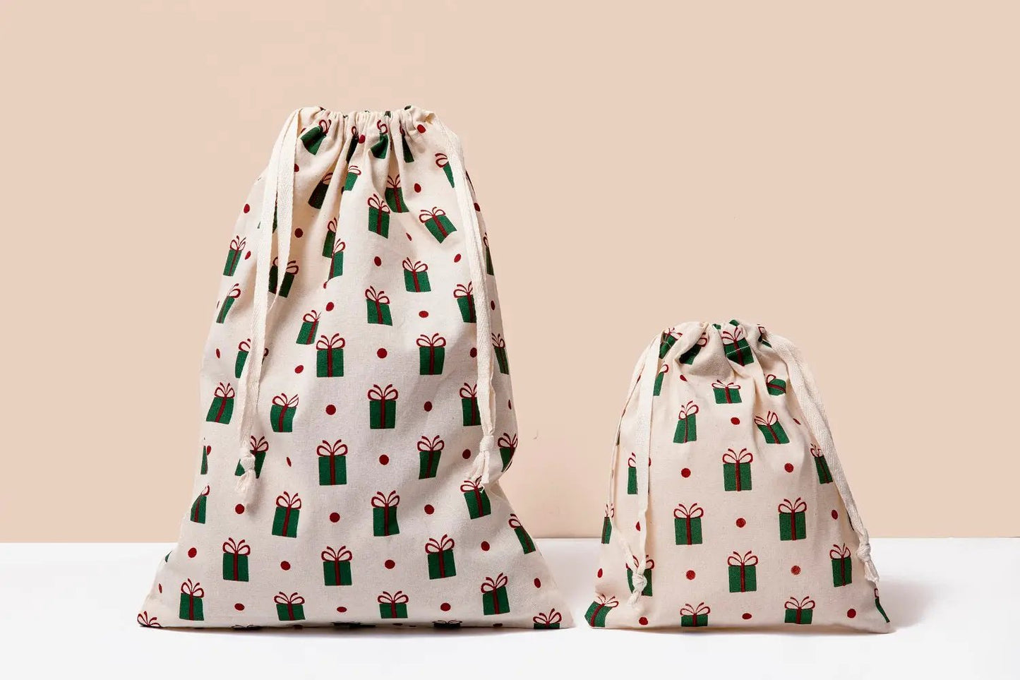 Cloth gift bags two natural cotton bags with green gift prints and red dot accents on Tampa Home & Garden Store