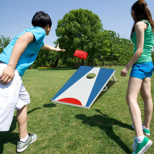 DirectDeals cornhole set 3x2ft with foldable legs, blue-white boards and red bean bag midair on Tampa Home & Garden Store