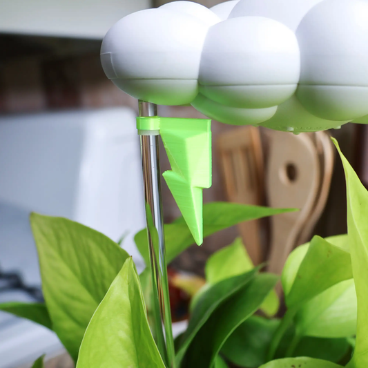 Original Dripping Rain Cloud houseplant accessory with neon lightning and white clouds on Tampa Home & Garden Store