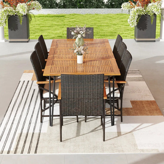 Wicker patio set with 8 armchairs and cushions around a wooden table on a patio on Tampa Home & Garden Store