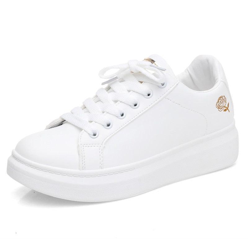 White leather platform sneakers with lace-up front and rose embroidery at heel on Tampa Home & Garden Store