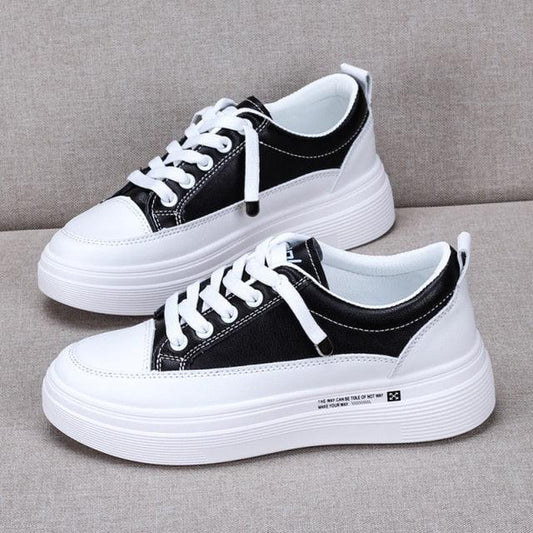 Stevvex women's leather sneakers pair with white platform sole, black upper and white laces on Tampa Home & Garden Store