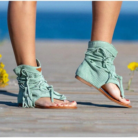 Pair of mint green perforated suede lace-up open-toe ankle sandals with tassels on Tampa Home & Garden Store