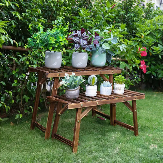 Large wooden plant stand with two shelves holding seven ceramic pots of succulents and greenery on Tampa Home & Garden Store