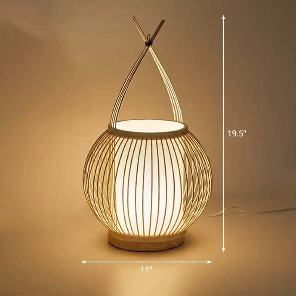 Woven bamboo bedside lantern with arched handle, warm glow, 11in width, 19.5in height on Tampa Home & Garden Store