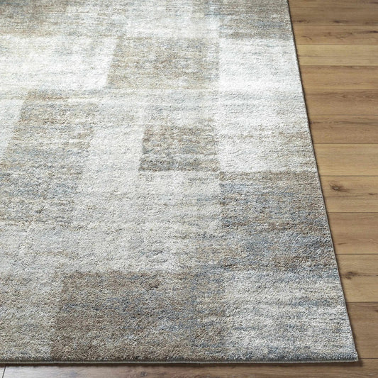 Xhosa Thick Luxe Rug in gray and beige with plush textured pile on wood floor on Tampa Home & Garden Store