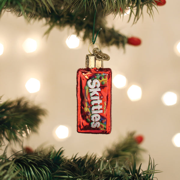 Skittles bag glass ornament on a Christmas tree with a red foil wrapper and colorful candy on Tampa Home & Garden Store
