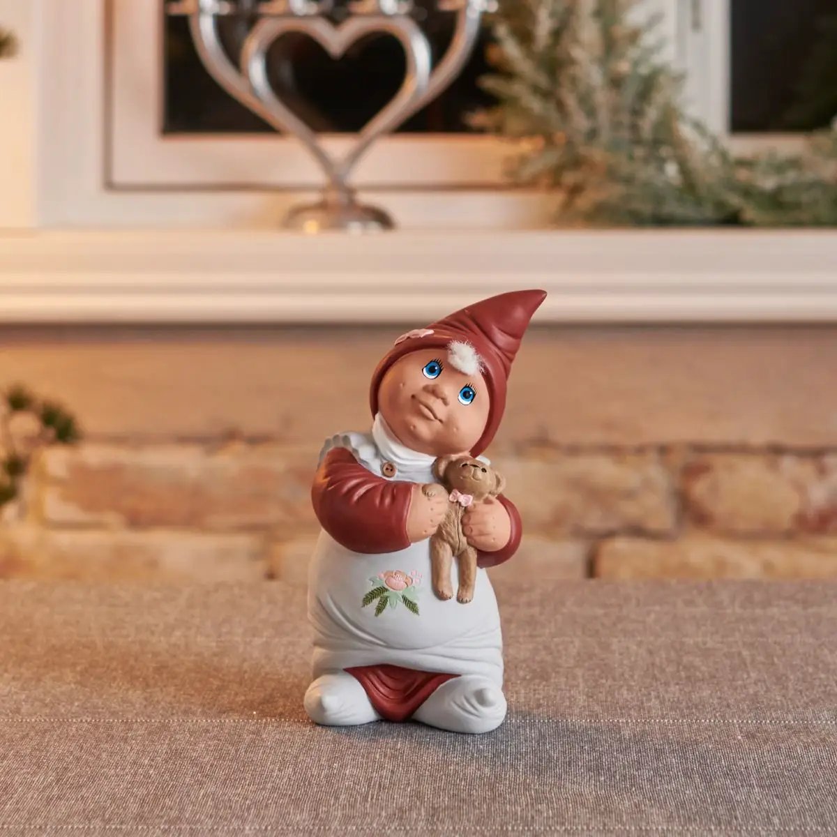 Aya Klarborg elf doll figurine dancing with teddy bear, red hat, white dress on Tampa Home & Garden Store