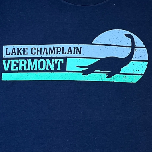 Vermont Champ navy T-shirt with Lake Champlain Legend graphic in teal and light blue on Tampa Home & Garden Store