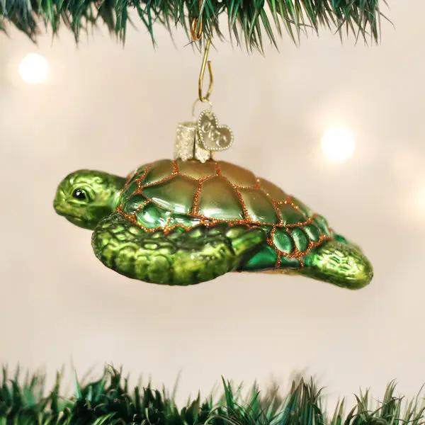 Green sea turtle glass ornament by The Country Christmas Loft hanging on Christmas tree on Tampa Home & Garden Store