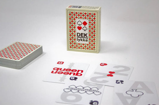 Dek of Cards Lykke Danish Playing Cards deck with cream tuck box and red/black suit border; two decks shown on table on Tampa Home & Garden Store
