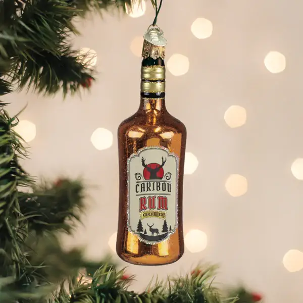 Caribou Rum glass ornament bottle charm in amber glass with label, holiday toast decor on Tampa Home & Garden Store