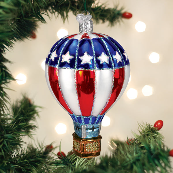 Patriotic hot air balloon glass ornament in red white blue with stars and gold basket on Tampa Home & Garden Store