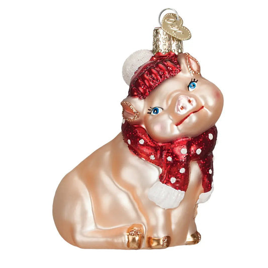 Snowy pig ornament with red glitter scarf and red knit hat, blue eyes on Tampa Home & Garden Store