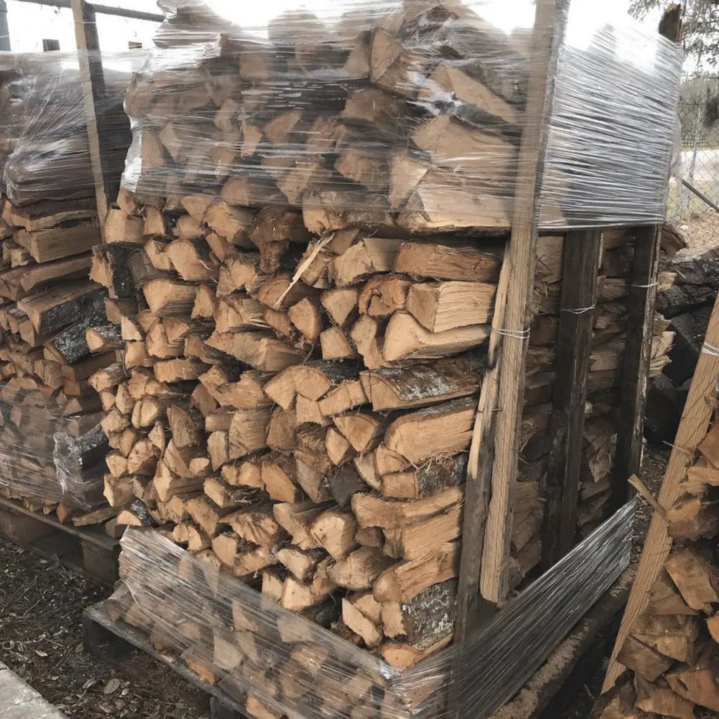 Split seasoned firewood batch, 75 & 150pc, stacked on pallet and wrapped in plastic on Tampa Home & Garden Store