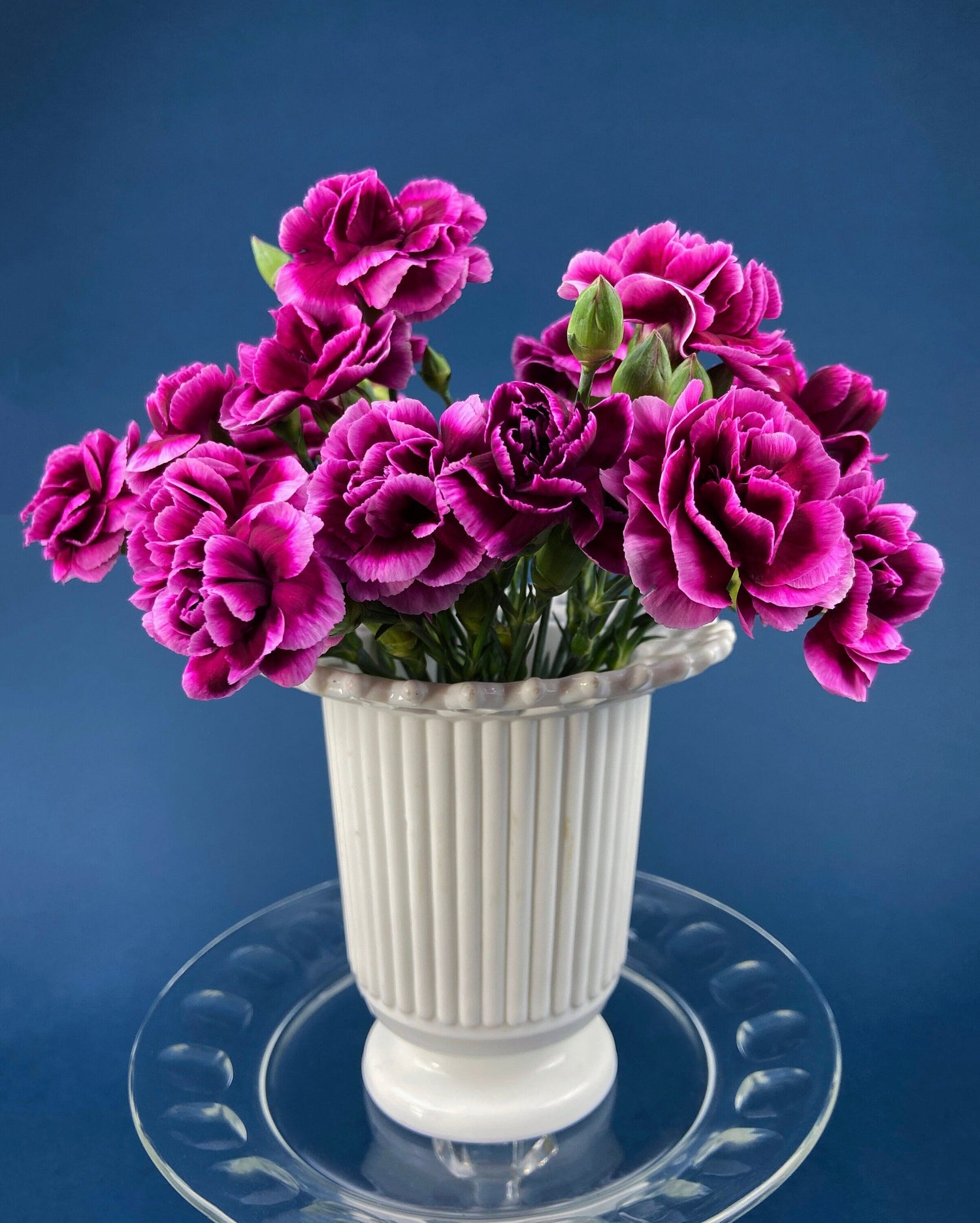 Fenton Glass Vintage Milk Glass vase shown on a blue background.
