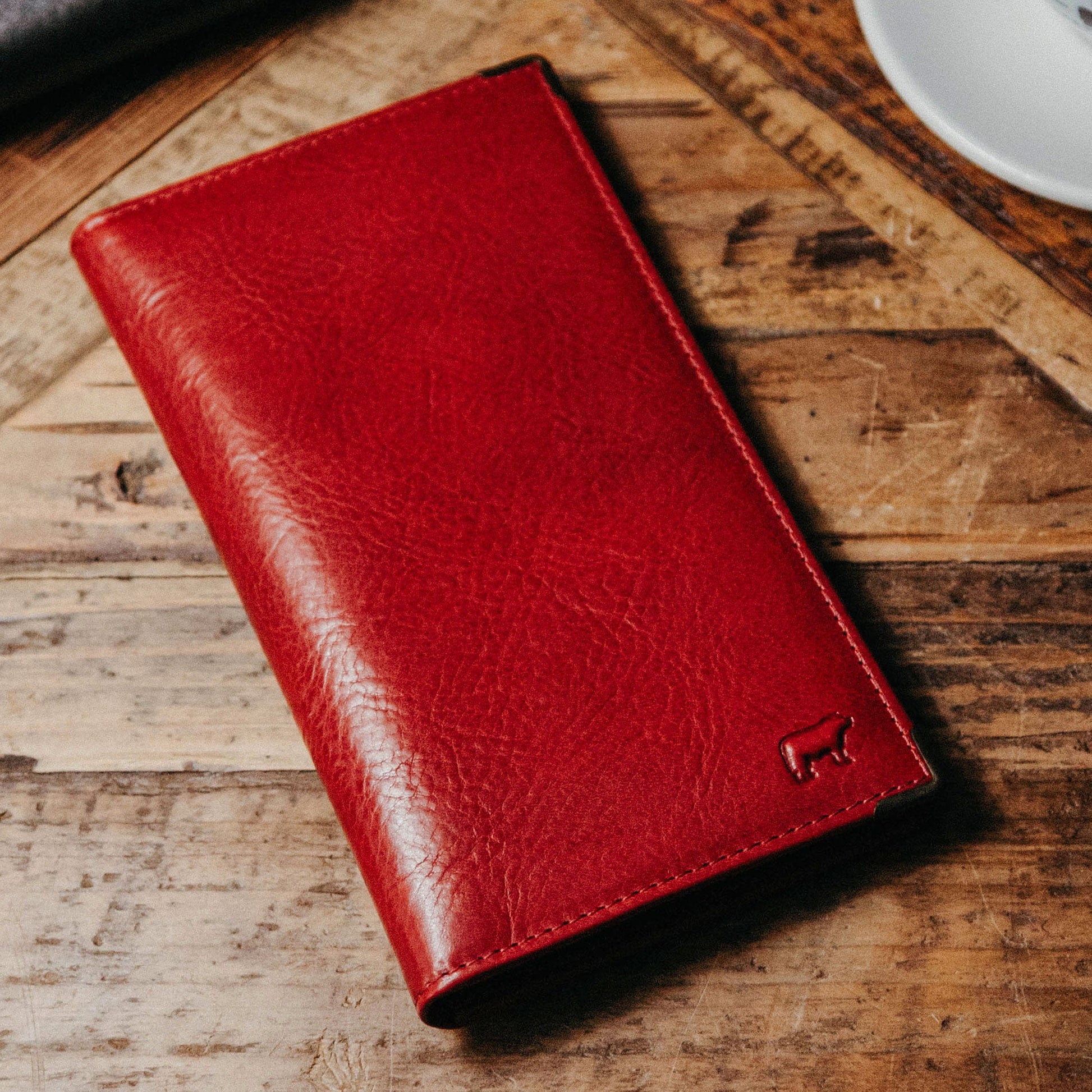 William Pocket Secretary Wallet by Will Leather Goods red leather card case on rustic wood on Tampa Home & Garden Store