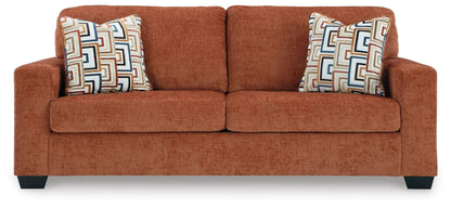Aviemore sofa burnt orange textured fabric two-seat with two geometric-pattern throw pillows on Tampa Home & Garden Store