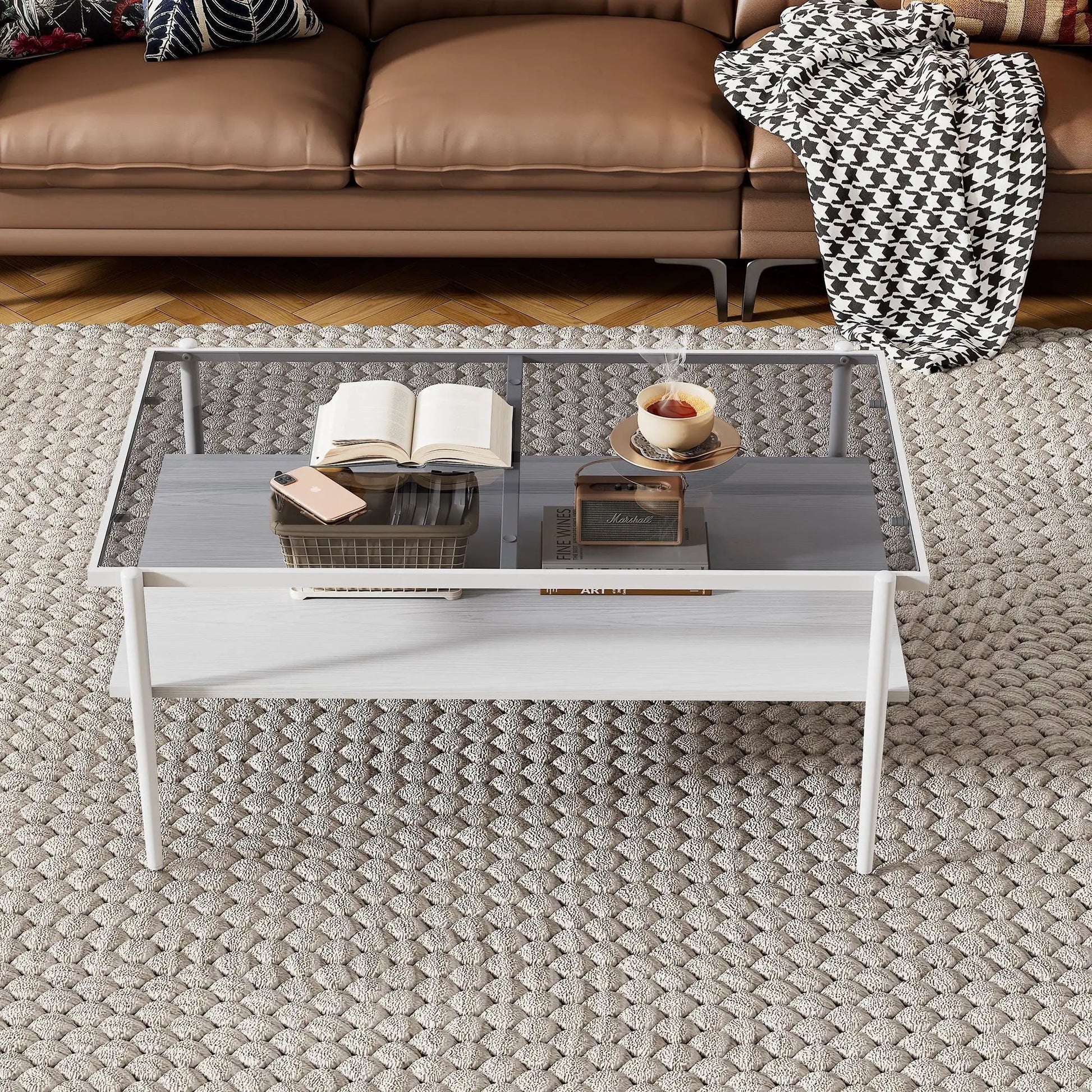 Rectangle coffee table with tempered glass top and metal legs before brown leather sofa on Tampa Home & Garden Store