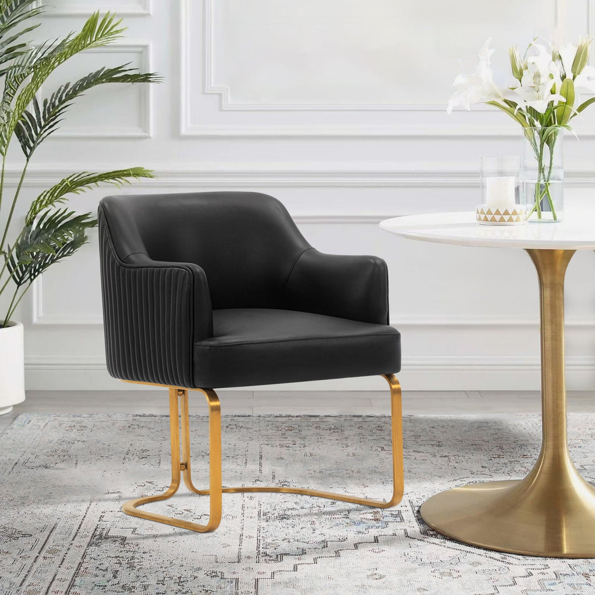 Black leather arm chair with gold cantilever legs HouseOfZazla on Tampa Home & Garden Store