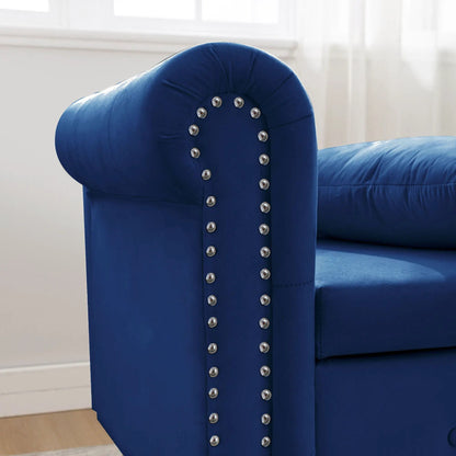Blue upholstered chaise lounge with nailhead trim and curved rolled arm on Tampa Home & Garden Store