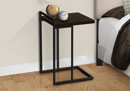 C-shaped accent table with dark wood top and black metal frame, amber vase and teal clock on Tampa Home & Garden Store