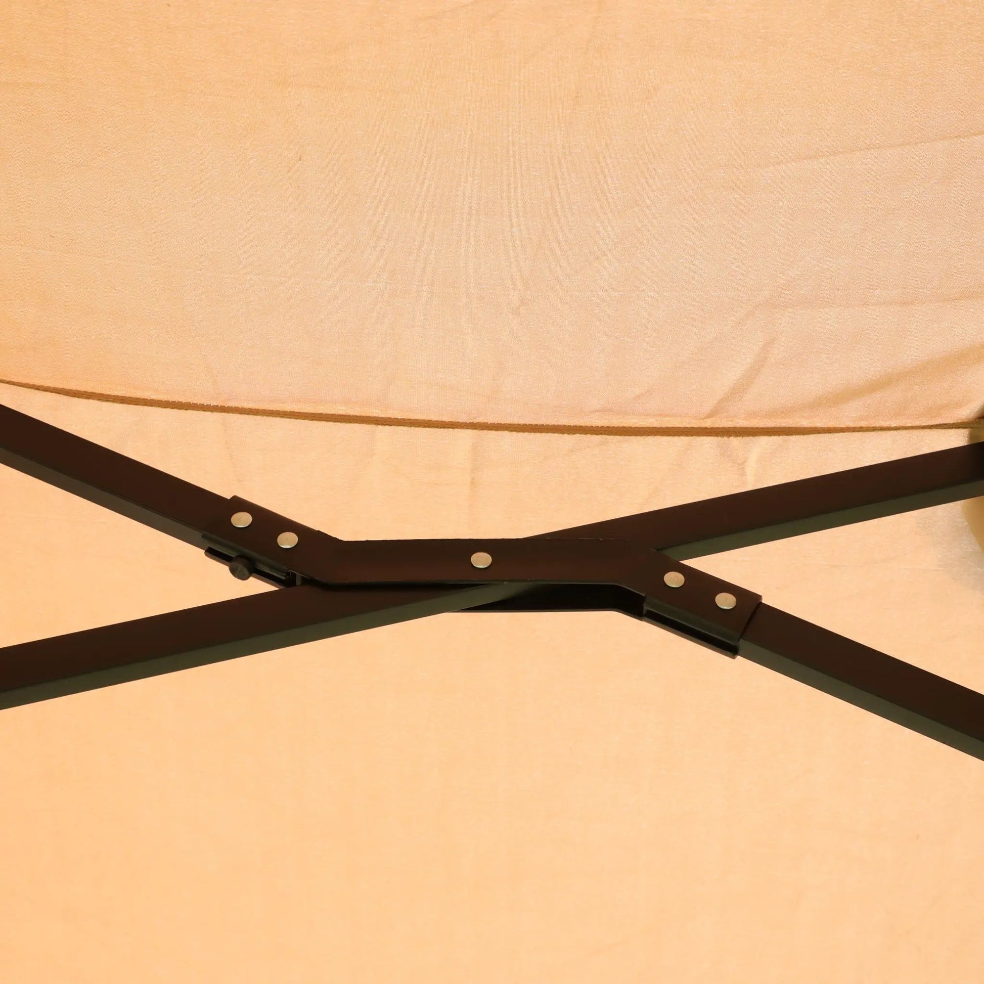 Double-Sided outdoor market umbrella frame with tan canopy and dark brown metal ribs on Tampa Home & Garden Store