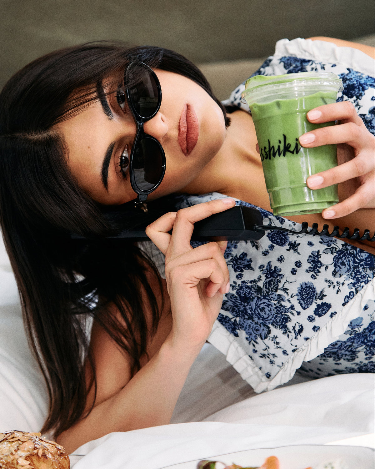 Samidori single cultivar matcha beverage in green isshiki cup held by a woman in sunglasses on Tampa Home & Garden Store