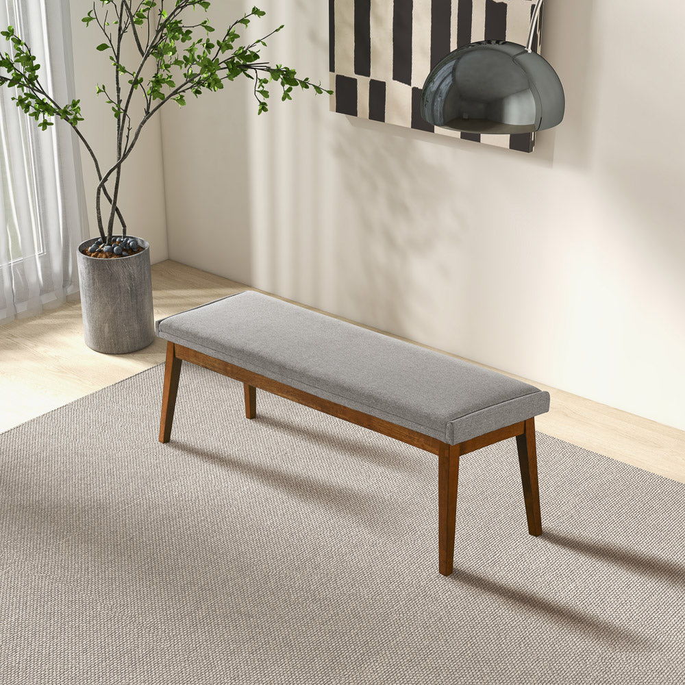 Ash gray upholstered bench with solid wood base and tapered legs in a modern space Garden on Tampa Home & Garden Store