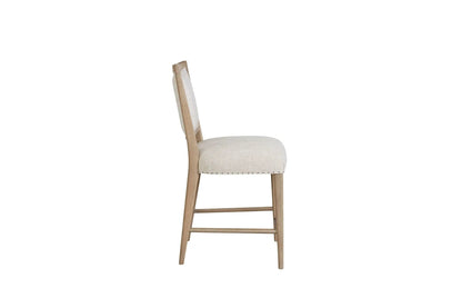 Counter stool sand-colored with beige upholstered seat and back, light wood legs on Tampa Home & Garden Store