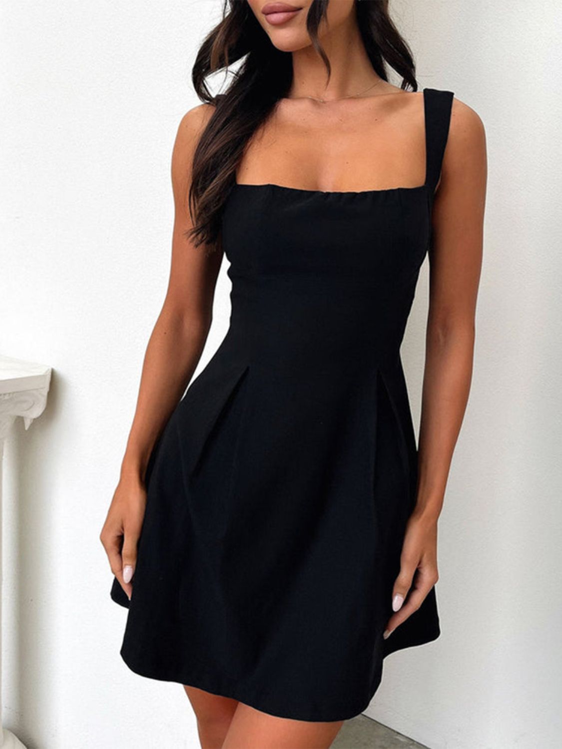 Black square-neck mini dress by Stevvex with wide straps and pleated skirt on Tampa Home & Garden Store