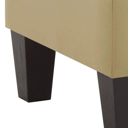 Casual beige upholstered ottoman with dark wood tapered legs on Tampa Home & Garden Store