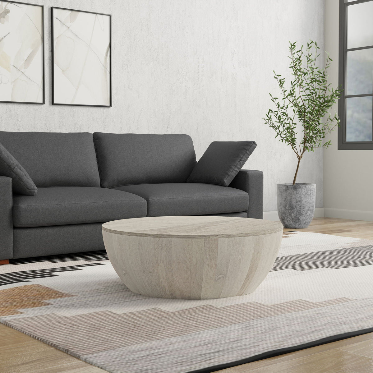 Elmbrook Drum Coffee Table by HouseOfZazla in light stone finish with drum silhouette on Tampa Home & Garden Store