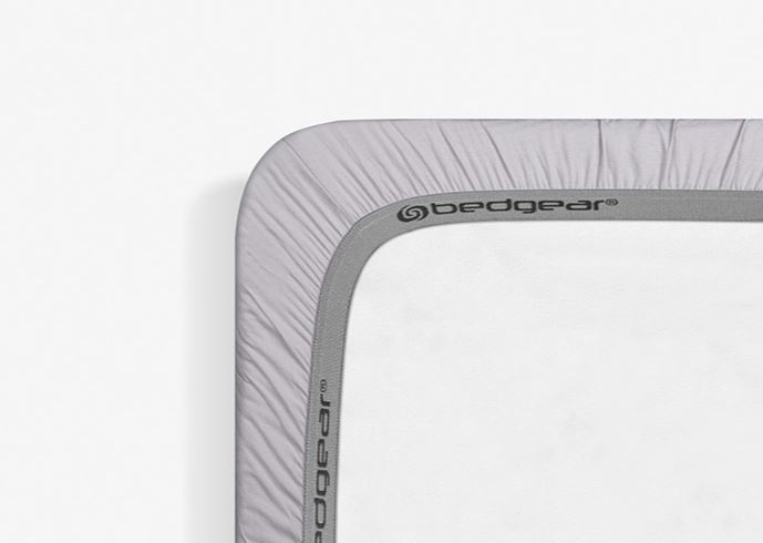 BedGear Hyper-Linen crib sheet in light grey with BedGear logo on branded trim on Tampa Home & Garden Store