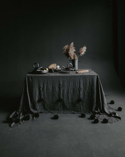 Shallow serving bowl with lid Guculia Shadow in dark ceramic on a moody table with pampas vase on Tampa Home & Garden Store