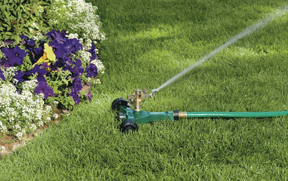 Brass impact sprinkler on metal wheel base watering lawn Orbit Irrigation large area sprinkler on Tampa Home & Garden Store