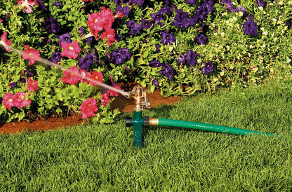 Brass impact sprinkler on metal step spike with green hose Orbit Irrigation area sprinkler on Tampa Home & Garden Store