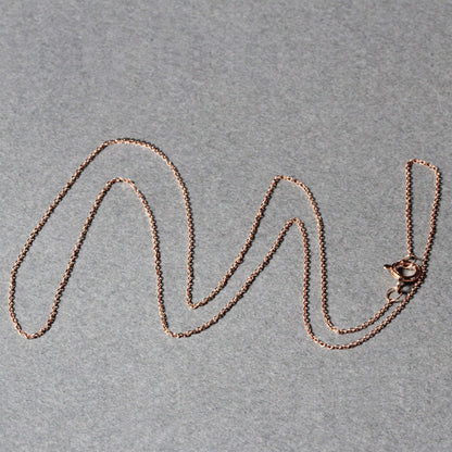 14k rose gold diamond-cut cable-link chain necklace 0.7mm on gray backdrop on Tampa Home & Garden Store