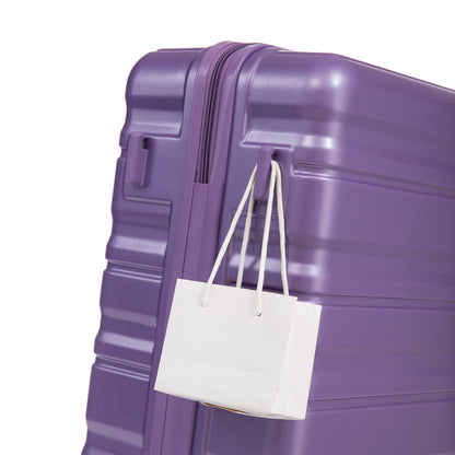 HIFINE purple ABS spinner luggage close-up with zipper and a white shopping bag hanging on Tampa Home & Garden Store
