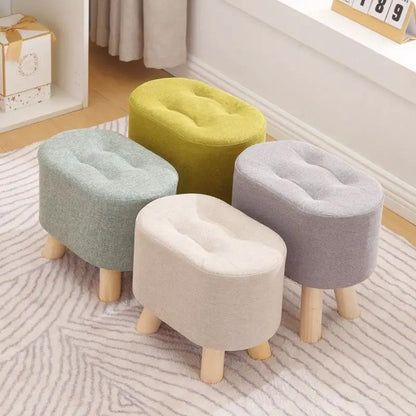 Nordic solid wood fabric ottomans set of five in pastel colors with natural wood legs on rug on Tampa Home & Garden Store
